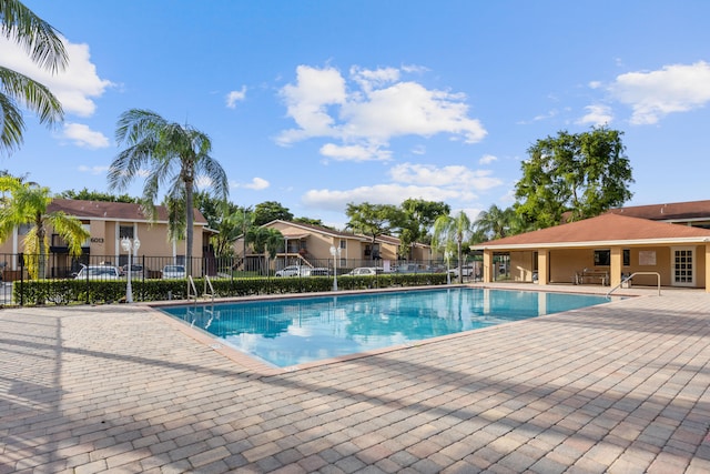 view of swimming pool with a patio area