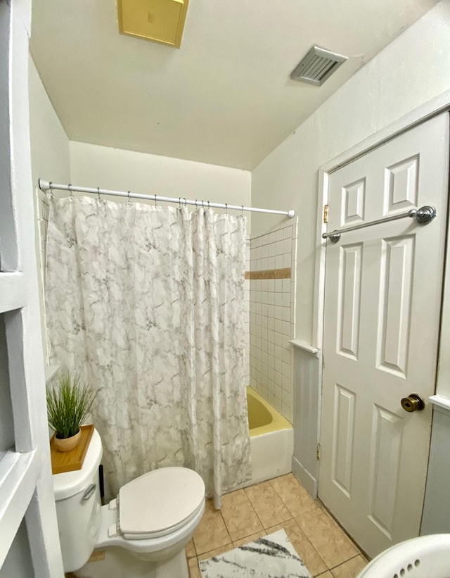 bathroom with tile patterned floors and toilet