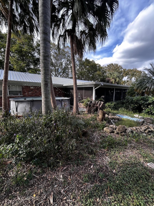 view of front of property with a sunroom