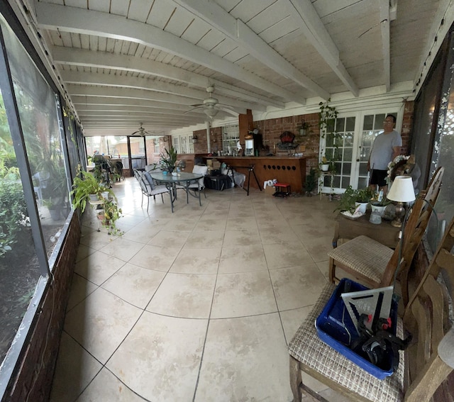 tiled dining area with ceiling fan and a wealth of natural light