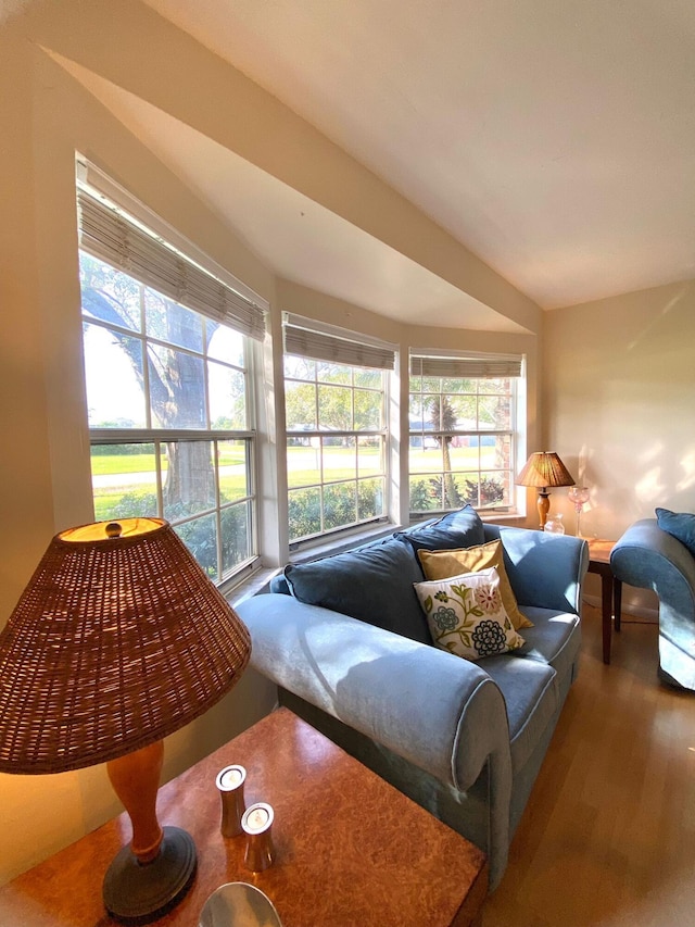 tiled living room featuring ceiling fan and wooden walls