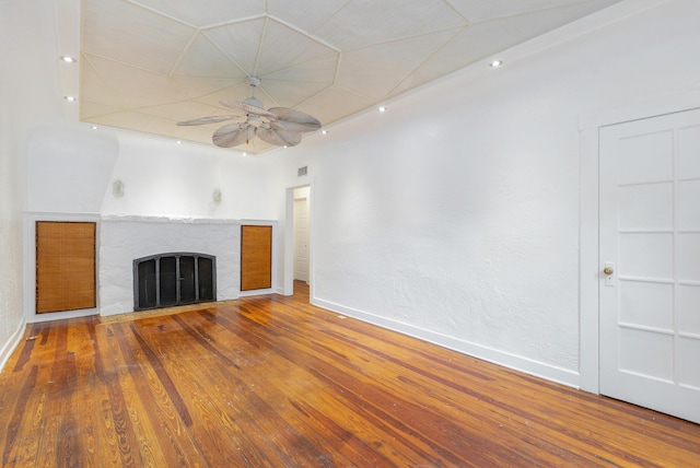 unfurnished living room featuring ceiling fan and wood-type flooring