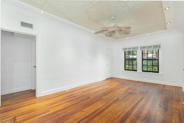 spare room featuring ceiling fan, ornamental molding, and hardwood / wood-style flooring