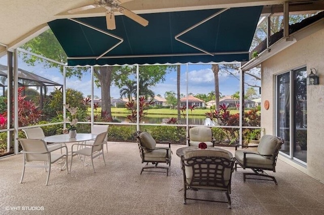 sunroom / solarium with a ceiling fan