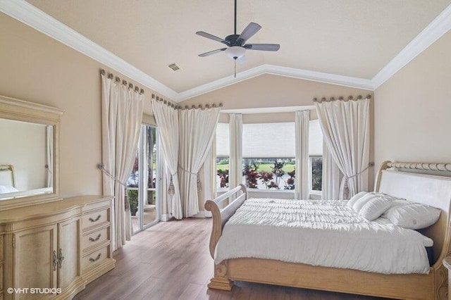 bedroom with wood finished floors, visible vents, lofted ceiling, ornamental molding, and access to exterior