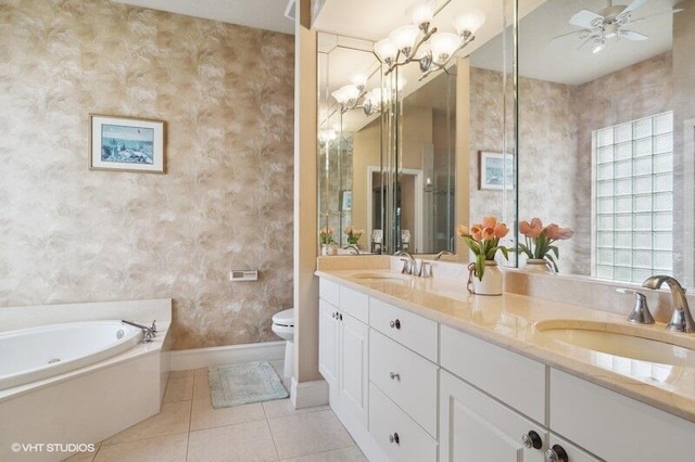 full bath with tile patterned floors, toilet, wallpapered walls, and a sink