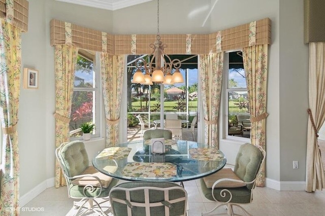 tiled dining area with ornamental molding, a wealth of natural light, and a chandelier