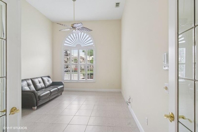 sitting room with light tile patterned flooring, baseboards, and visible vents