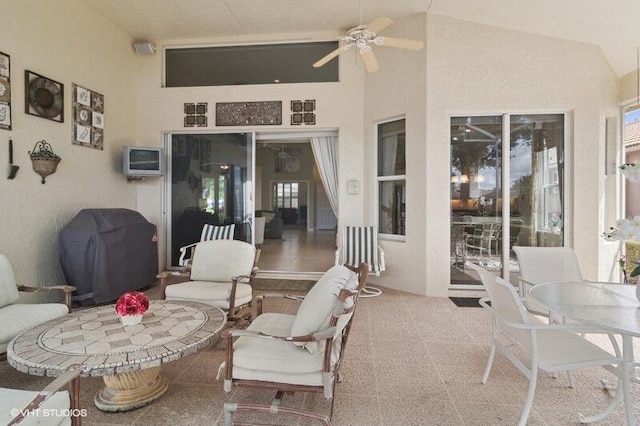 view of patio featuring outdoor dining area, a ceiling fan, and grilling area