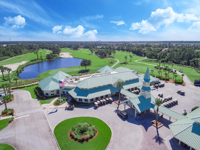 birds eye view of property featuring golf course view and a water view