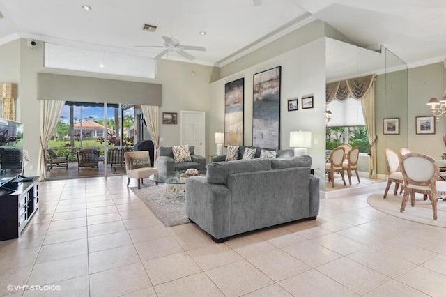 tiled living room featuring a towering ceiling, ceiling fan, and crown molding