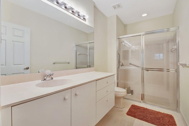 bathroom with hardwood / wood-style floors, vanity, a shower with shower door, and toilet