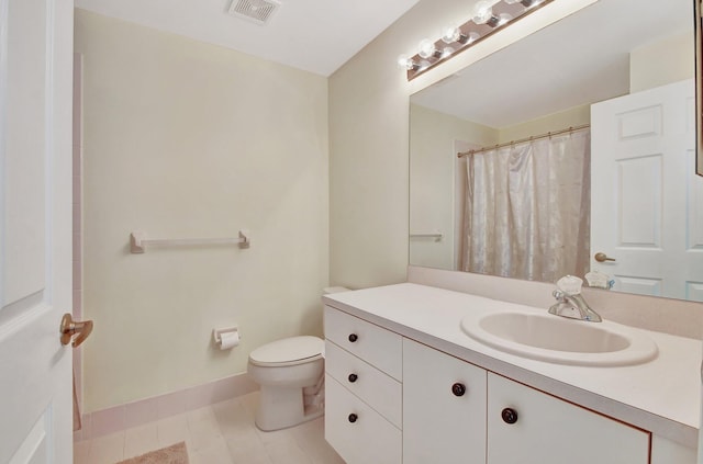 bathroom featuring vanity, curtained shower, and toilet