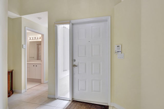 foyer featuring light tile patterned floors