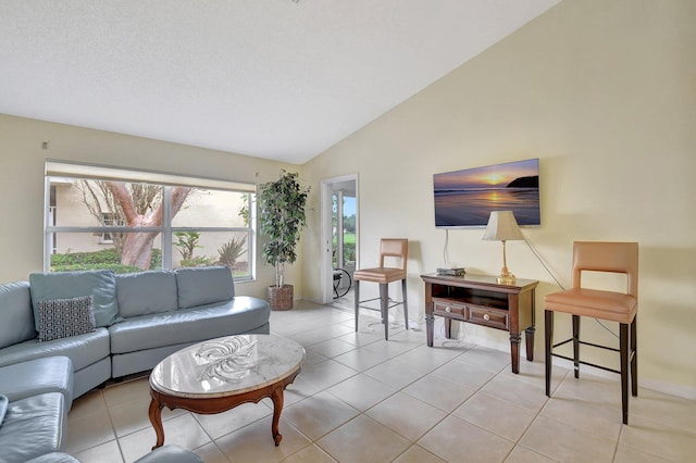 tiled living room with vaulted ceiling