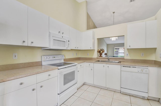 kitchen featuring white cabinetry, sink, high vaulted ceiling, white appliances, and light tile patterned floors