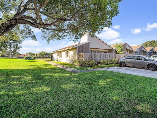 view of side of property with a yard