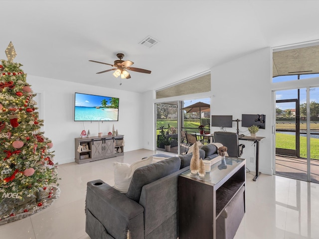 living room with ceiling fan and light tile patterned floors