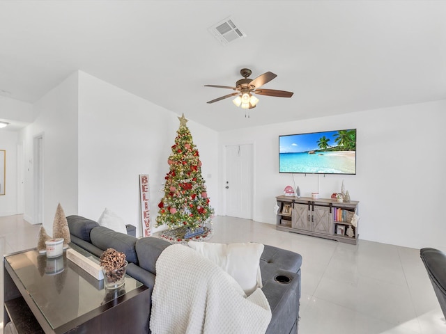 tiled living room featuring ceiling fan