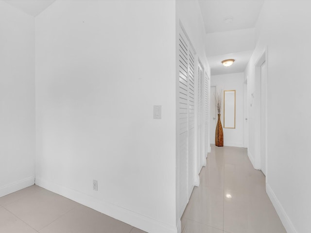 corridor featuring light tile patterned floors