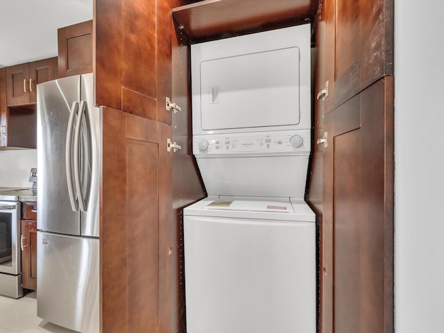 laundry area with stacked washer / drying machine