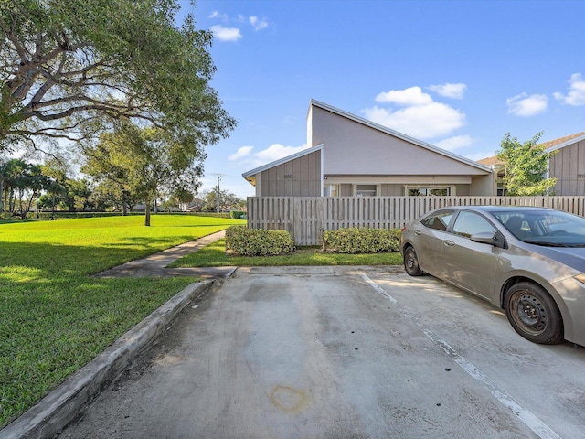 view of property exterior featuring a lawn