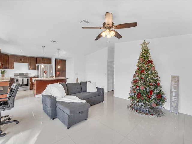 tiled living room featuring ceiling fan