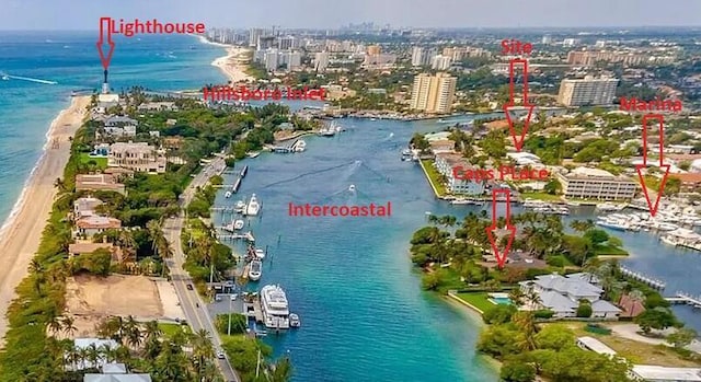 birds eye view of property with a water view