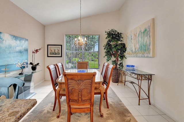 dining room with an inviting chandelier, lofted ceiling, and light tile patterned flooring