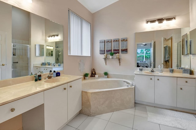 bathroom with tile patterned flooring, vanity, ceiling fan, and plus walk in shower