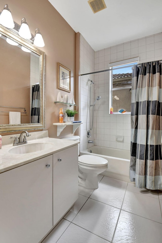 full bathroom featuring toilet, vanity, tile patterned floors, and shower / tub combo with curtain