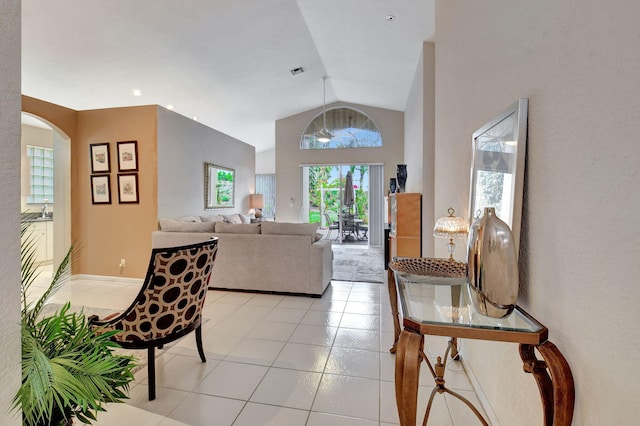 tiled living room with lofted ceiling