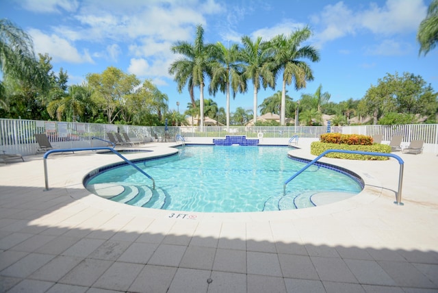 view of swimming pool with a patio area