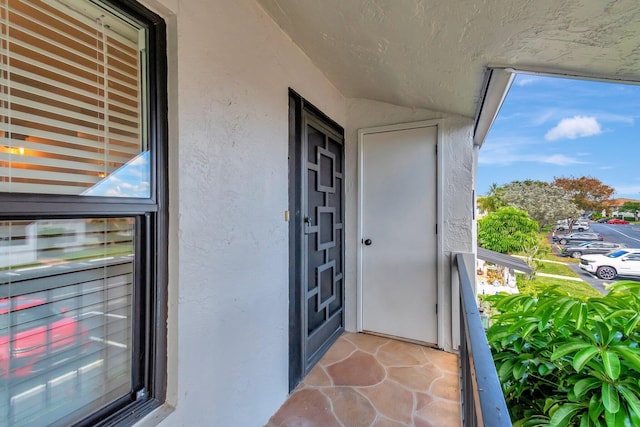 5770 Princess Palm Ct Unit F, Delray Beach, FL 33484 - entrance to property featuring stucco siding and a balcony