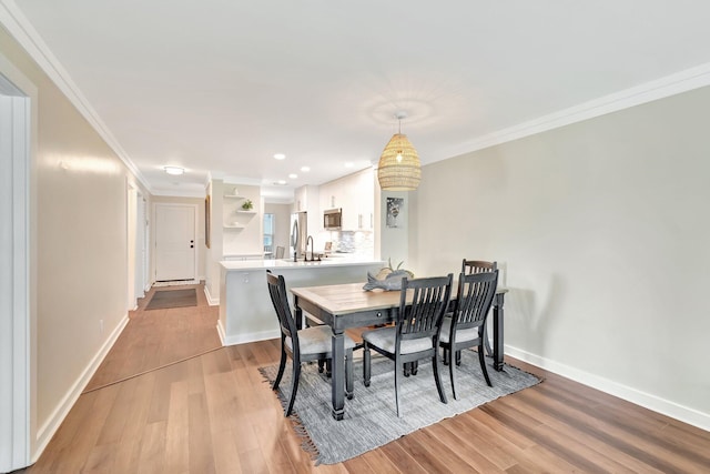 5770 Princess Palm Ct Unit F, Delray Beach, FL 33484 - dining space featuring light wood-type flooring, crown molding, and recessed lighting