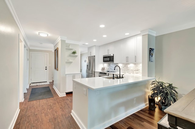 5770 Princess Palm Ct Unit F, Delray Beach, FL 33484 - kitchen featuring appliances with stainless steel finishes, open shelves, crown molding, dark wood-style flooring, and a peninsula