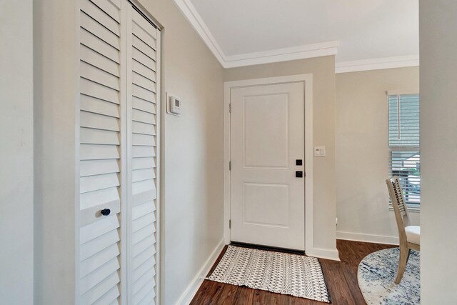 dining space with dark hardwood / wood-style flooring, ornamental molding, and sink