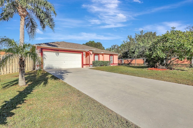 single story home with a garage and a front lawn