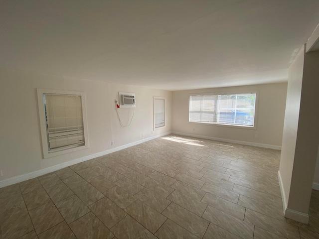 spare room featuring a wall mounted air conditioner