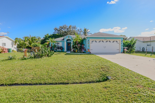 ranch-style home featuring a front lawn and a garage