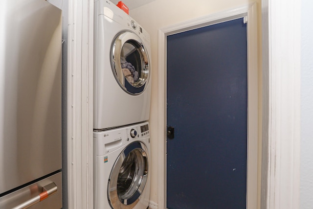 laundry room featuring stacked washer / dryer