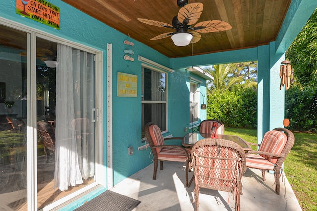 view of patio featuring ceiling fan