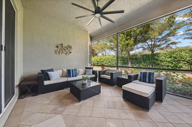 sunroom / solarium featuring ceiling fan