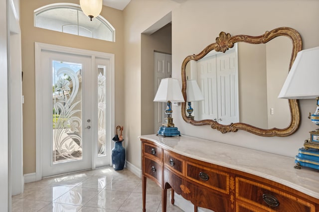 foyer with light tile patterned flooring