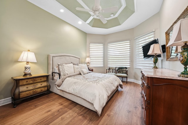 bedroom with hardwood / wood-style flooring and ceiling fan