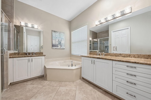 8313 Boulder Mountain Ter, Boynton Beach, FL 33473 - bathroom featuring two vanities, a stall shower, a bath, and tile patterned flooring