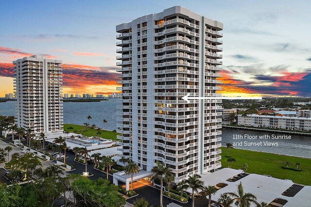 outdoor building at dusk featuring a water view