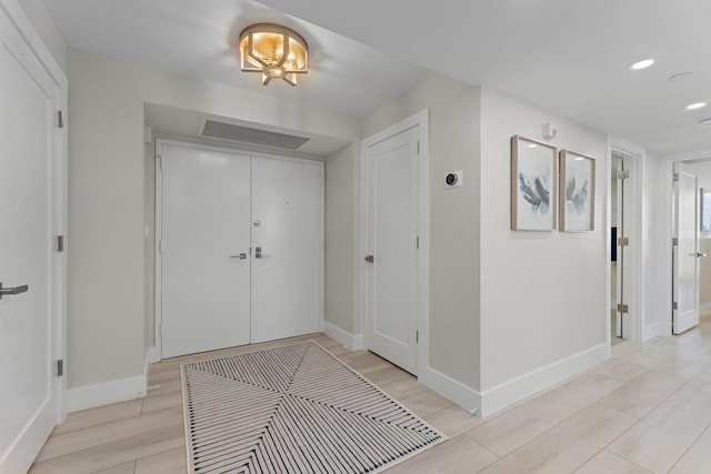 foyer with light hardwood / wood-style flooring