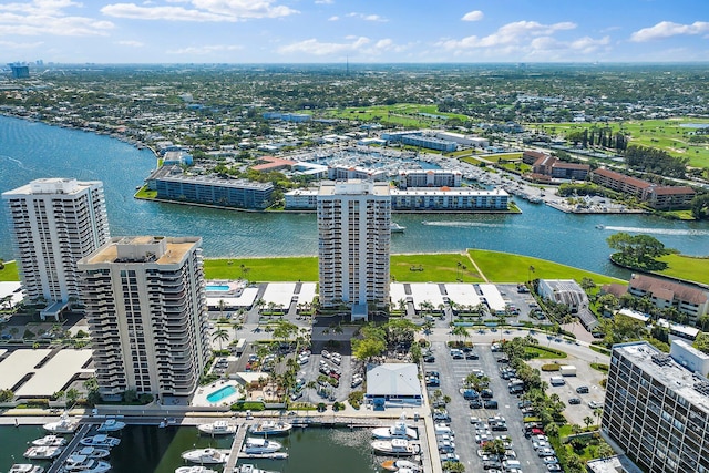 view of property's community featuring a water view and a lawn