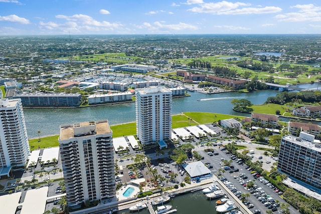 view of home's community with a water view and a yard